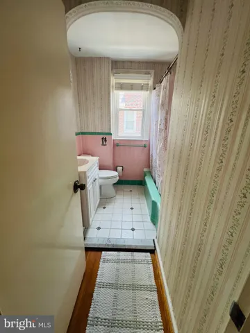 a spacious bedroom with a bed and a couch