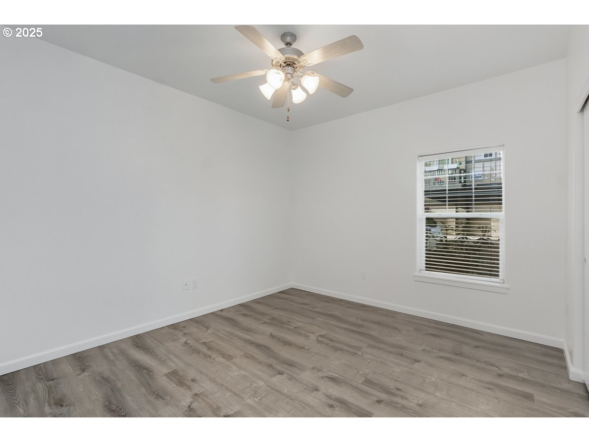 1180 Southwest 170th Avenue, Unit 100 Beaverton, OR 97003 - Photo 17 of 32 a view of an empty room with a window
