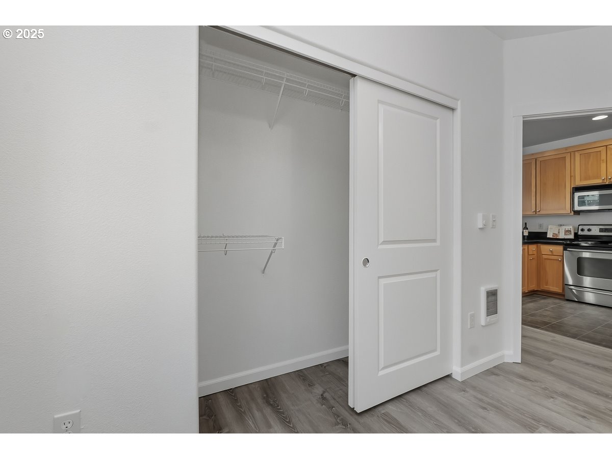 1180 Southwest 170th Avenue, Unit 100 Beaverton, OR 97003 - Photo 19 of 32 a view of kitchen with wooden floor