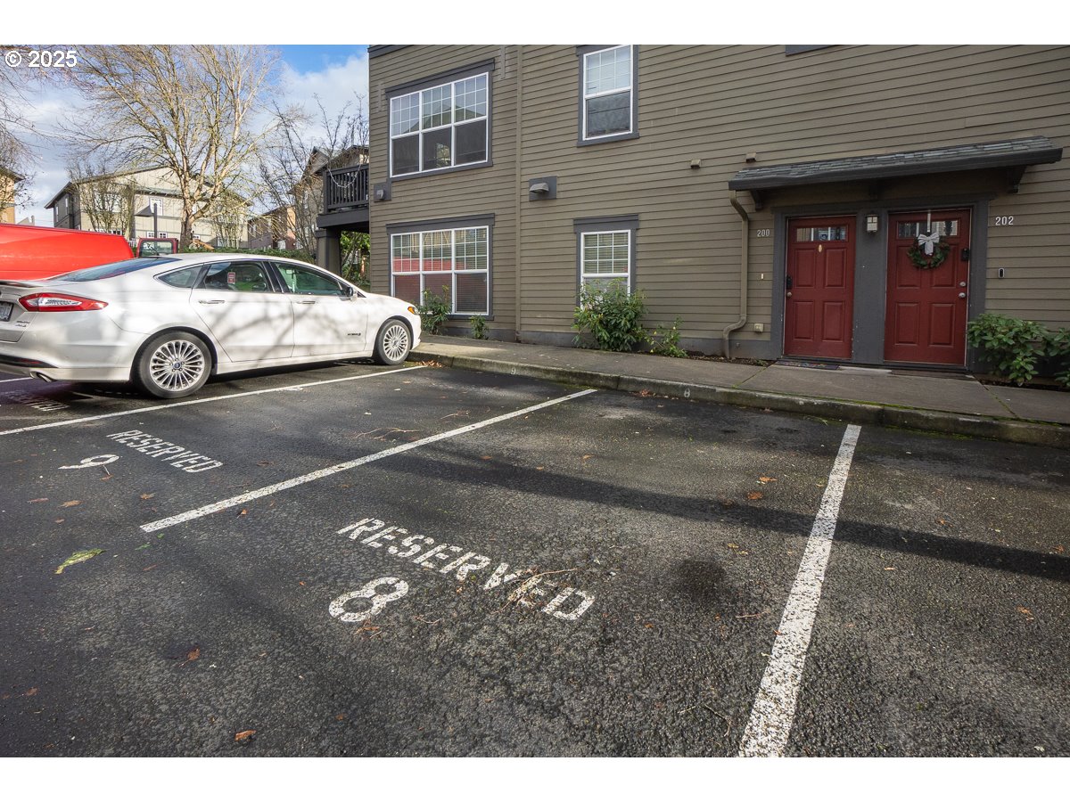 1180 Southwest 170th Avenue, Unit 100 Beaverton, OR 97003 - Photo 27 of 32 a view of a cars park in front of a building