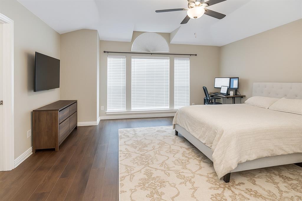 8557 Brittania Way Dallas, TX 75243 - Photo 7 of 18 Bedroom with wood finished floors and a ceiling fan
