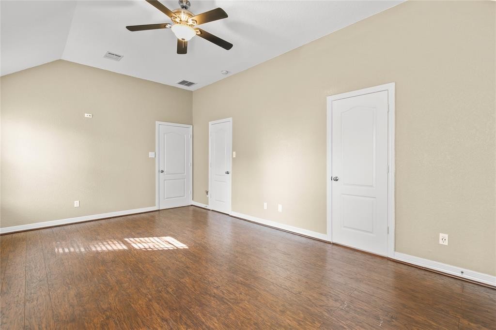 3818 Springcrest Lane Montgomery, TX 77356 - Photo 12 of 19 an empty room with wooden floor and ceiling fan