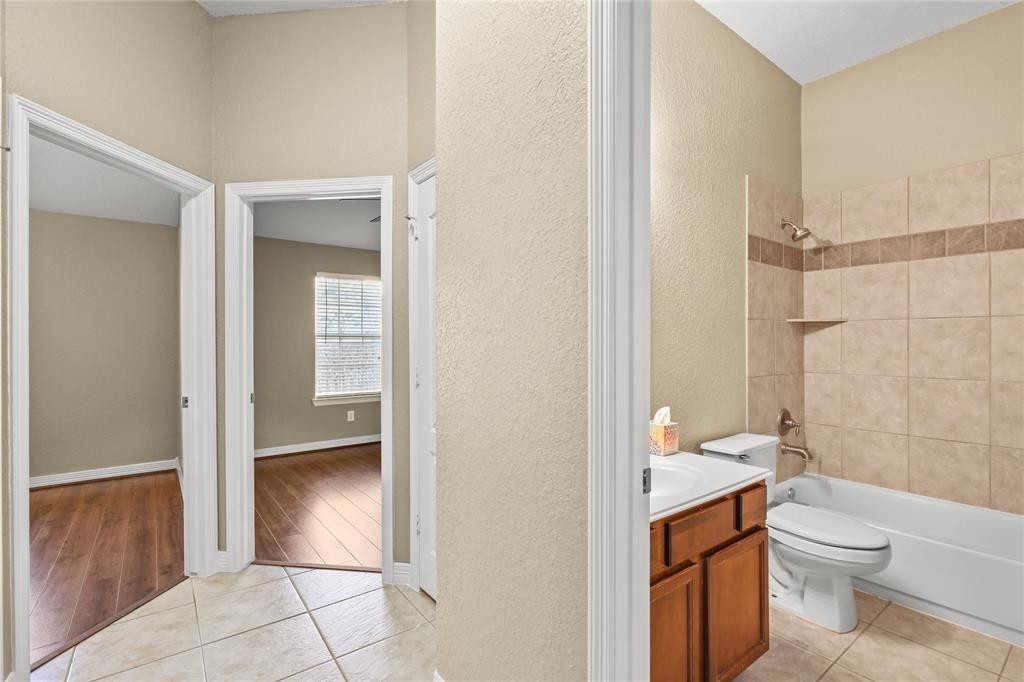3818 Springcrest Lane Montgomery, TX 77356 - Photo 16 of 19 a bathroom with a toilet a sink and shower