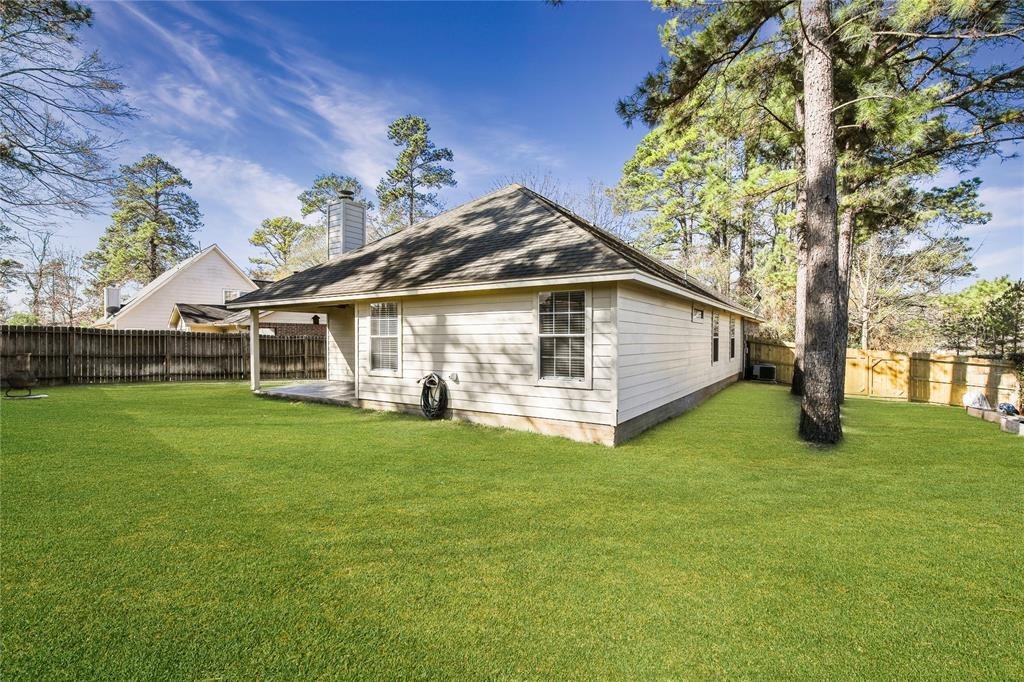 3818 Springcrest Lane Montgomery, TX 77356 - Photo 18 of 19 a front view of a house with a garden