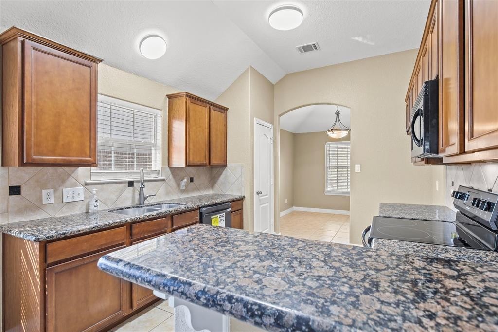 3818 Springcrest Lane Montgomery, TX 77356 - Photo 8 of 19 a bathroom with a granite countertop sink and a mirror