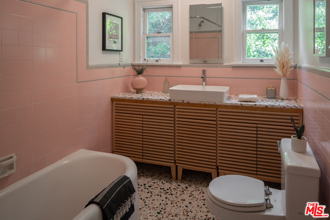 3640 Roderick Road Los Angeles, CA 90065 - Photo 19 of 27 a bathroom with a sink a toilet and a window