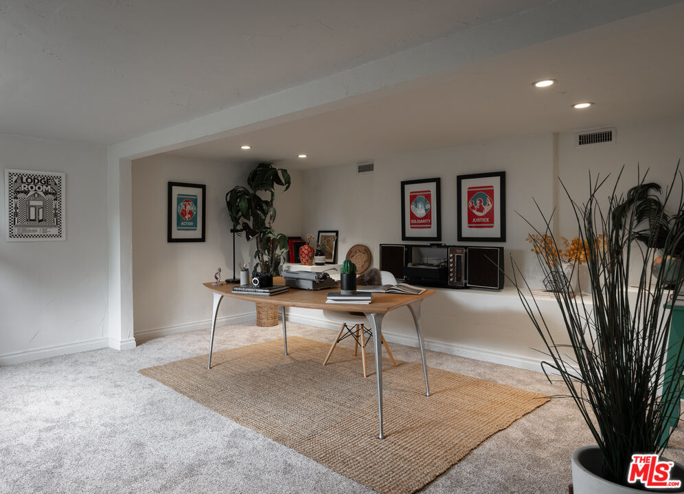 3640 Roderick Road Los Angeles, CA 90065 - Photo 21 of 27 a living room with fireplace furniture and a potted plant