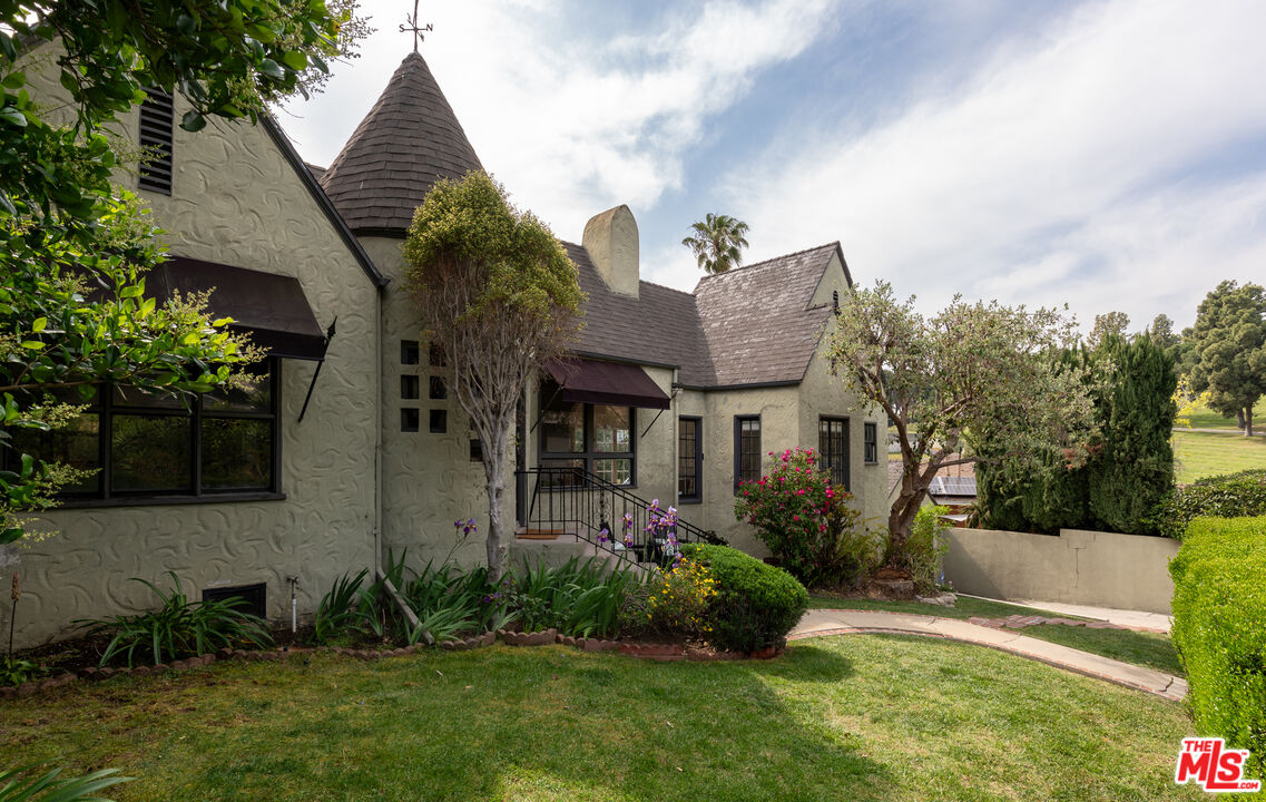 3640 Roderick Road Los Angeles, CA 90065 - Photo 25 of 27 a view of house with a yard and potted plants