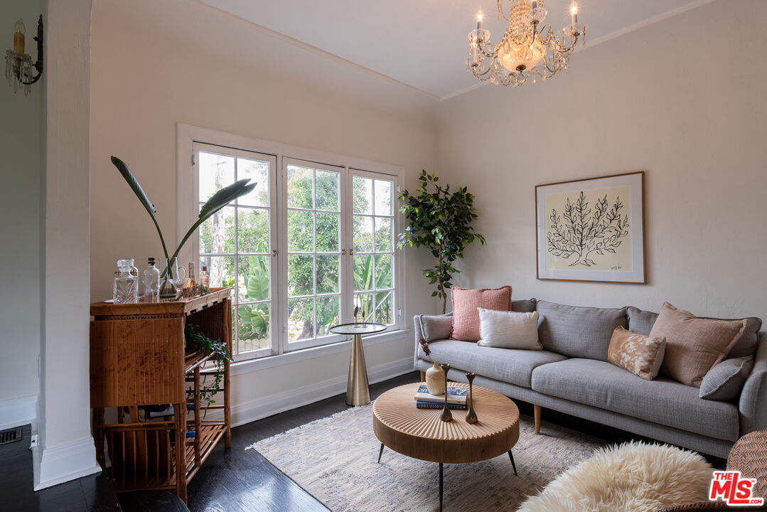 3640 Roderick Road Los Angeles, CA 90065 - Photo 4 of 27 a living room with furniture a table and a large window