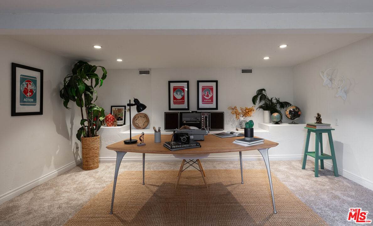 3640 Roderick Road Los Angeles, CA 90065 - Photo 5 of 27 a living room with furniture a flat screen tv and a potted plant