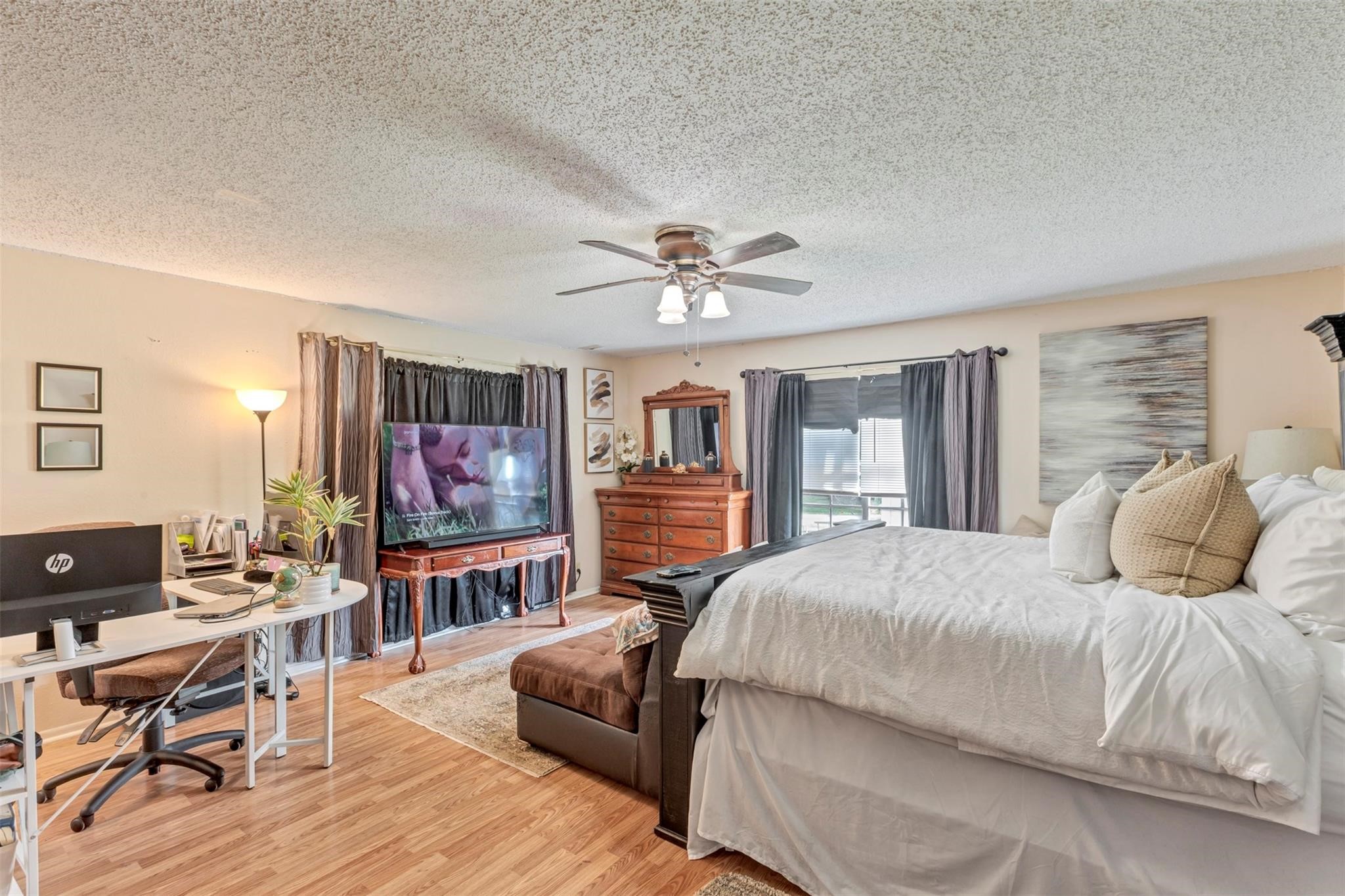 808 Morrell Street Baytown, TX 77520 - Photo 14 of 25 a bedroom with a beds and a chandelier
