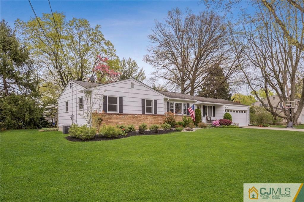 1 Ryan Road Cranbury, NJ 08512 - Photo 1 of 22 a front view of a house with a garden