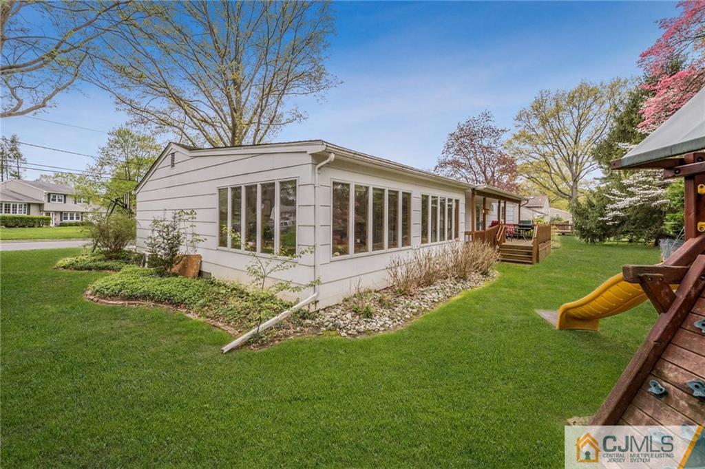 1 Ryan Road Cranbury, NJ 08512 - Photo 18 of 22 a view of a house with a yard deck and a large tree