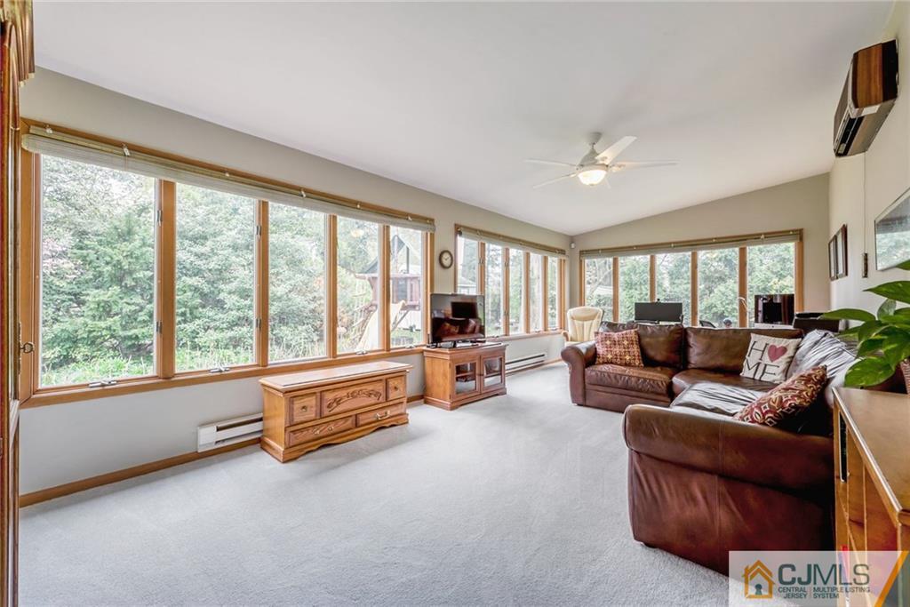 1 Ryan Road Cranbury, NJ 08512 - Photo 8 of 22 a living room with furniture and a large window with outer view