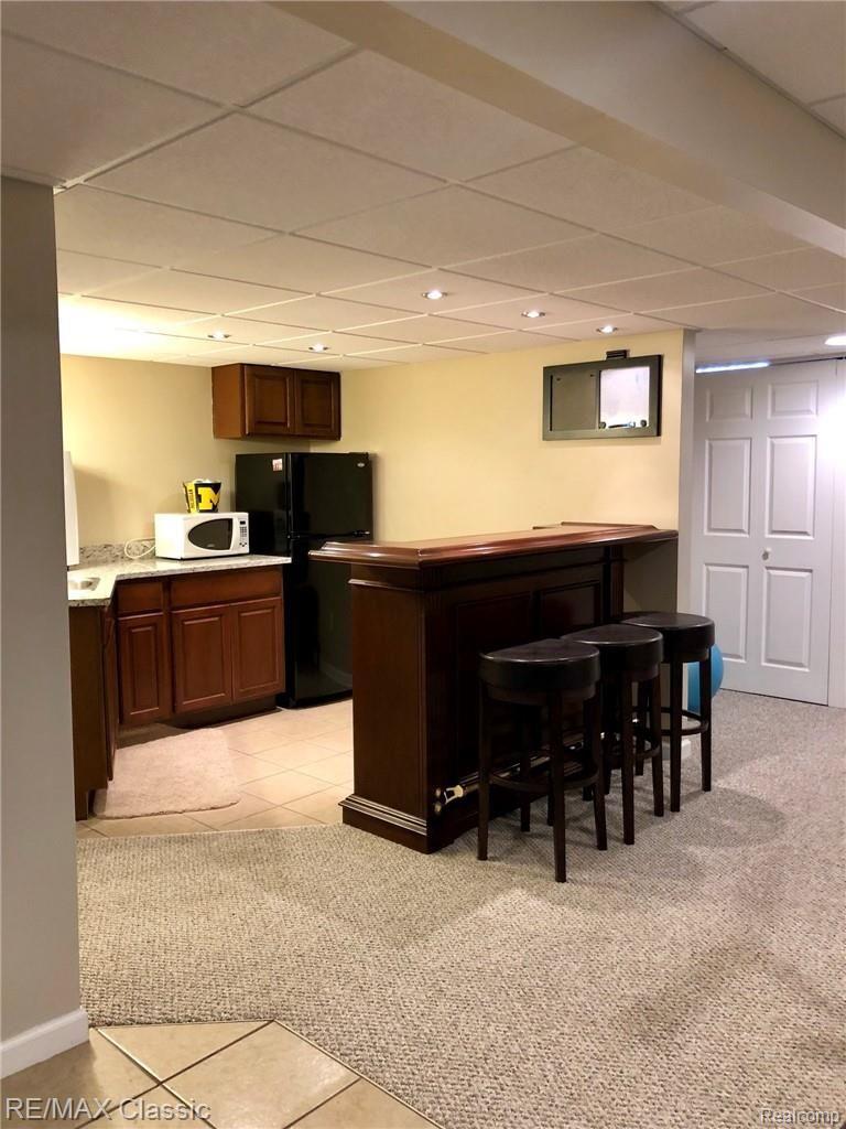 564 Ridge Point Drive Dundee, MI 48131 - Photo 33 of 64 Separate bar area with lots of additional storage too