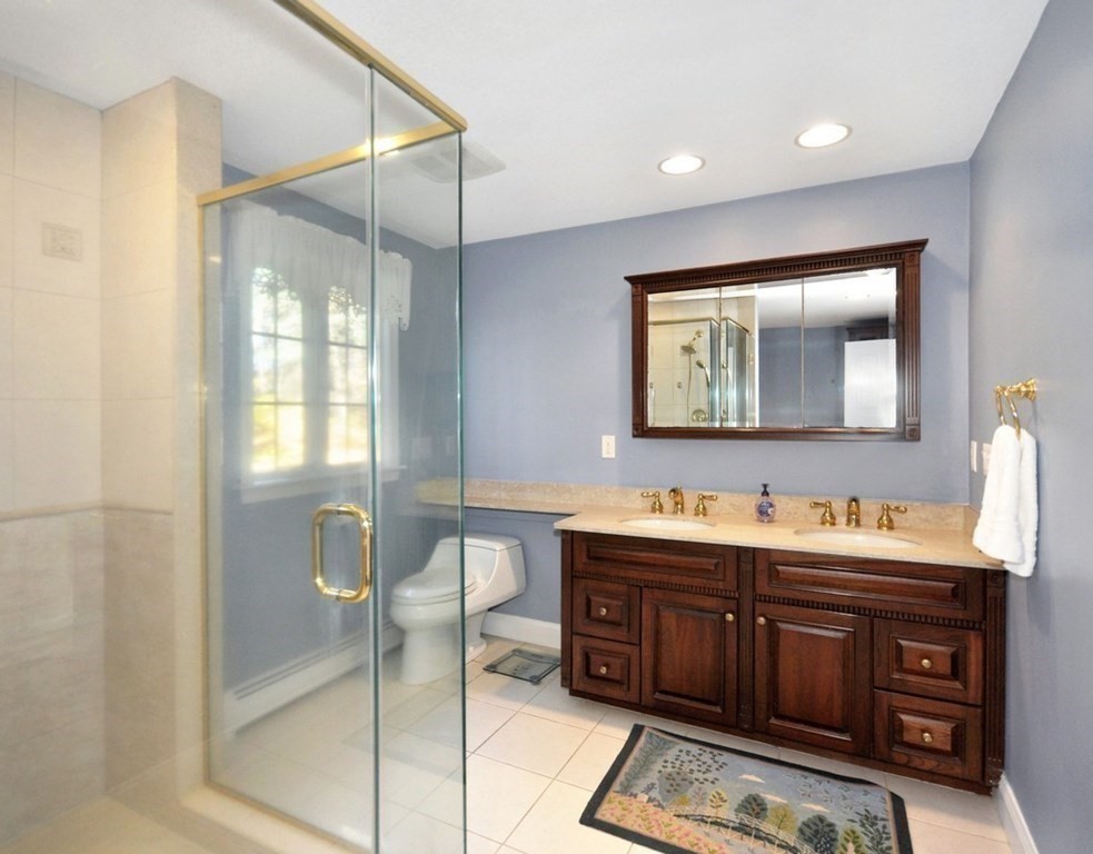 149 College Road Concord, MA 01742 - Photo 18 of 31 a bathroom with a double vanity sink and a mirror