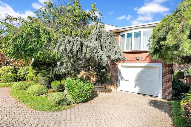a backyard of a house with a garden and plants