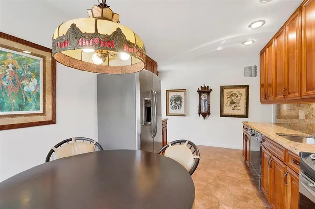 a view of a kitchen with a sink cabinets and a dishwasher