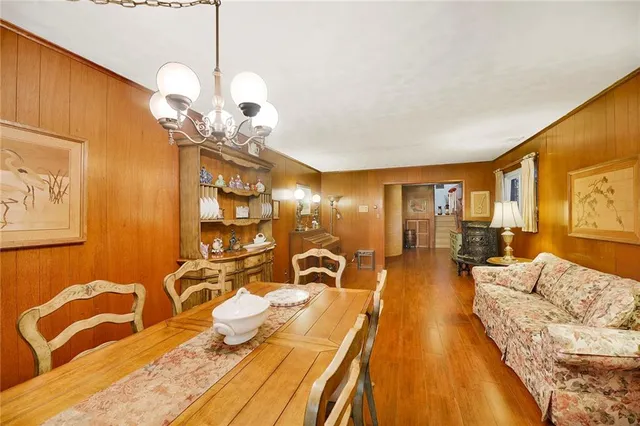 a view of a livingroom with furniture and chandelier