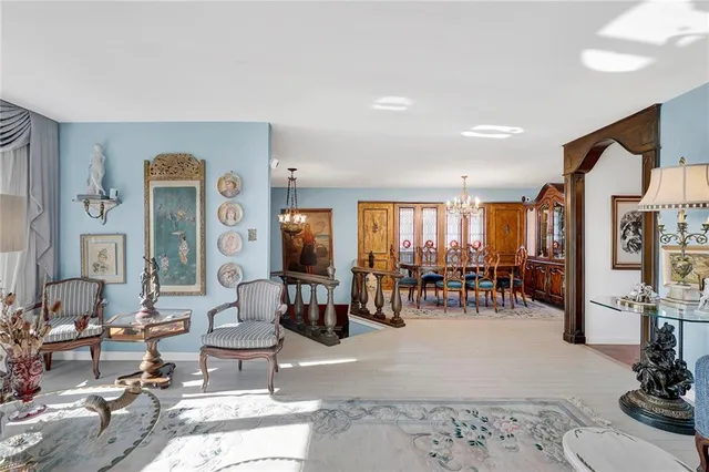 a living room with lots of furniture and white walls