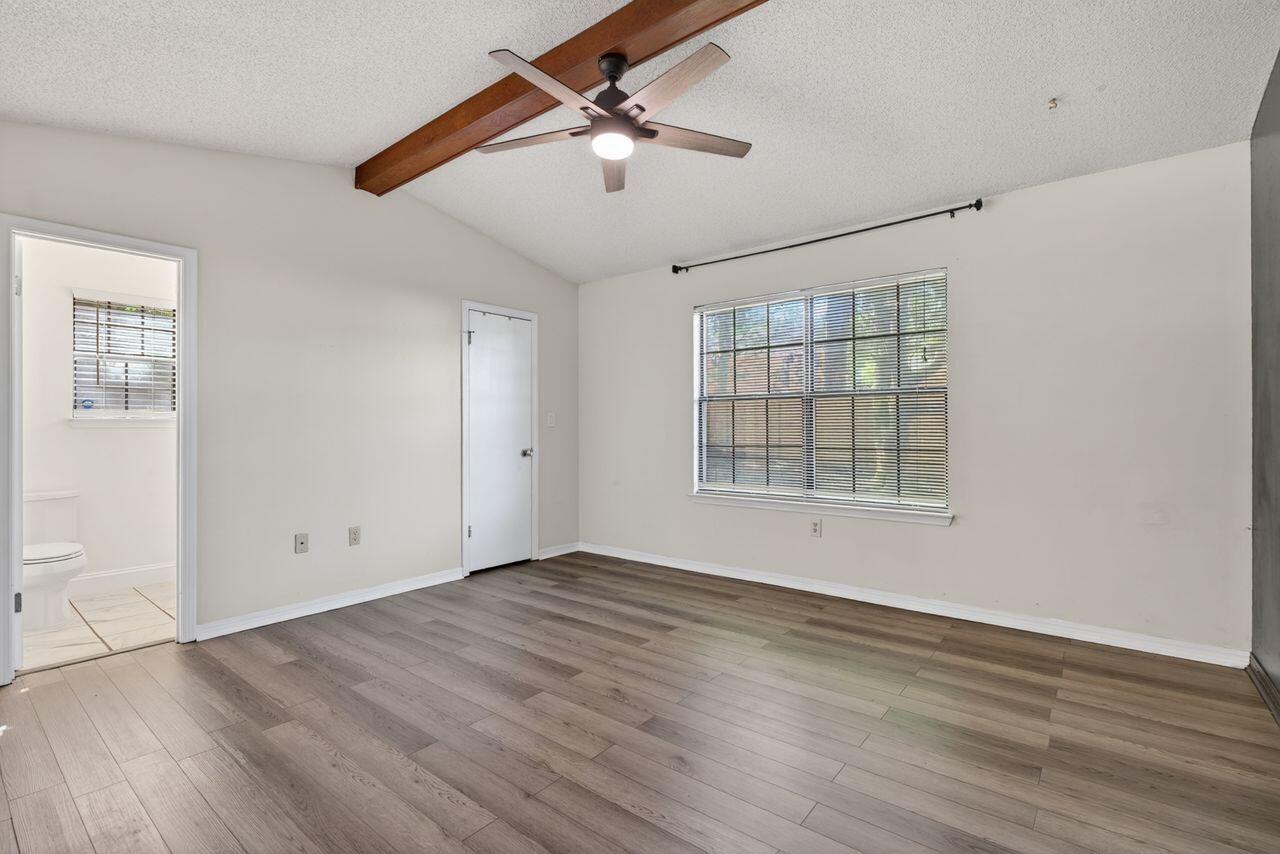 121 Campbell Street Crestview, FL 32536 - Photo 21 of 45 Primary Bedroom with vaulted ceiling