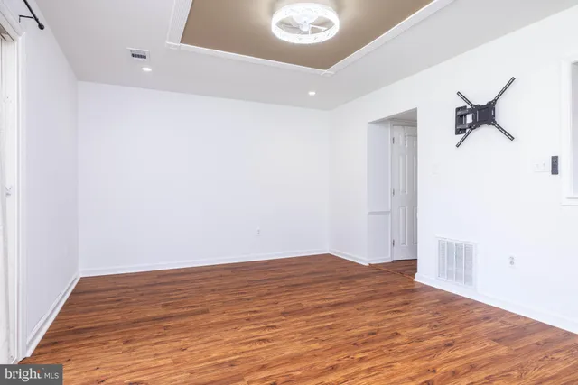 a view of a livingroom with wooden floor