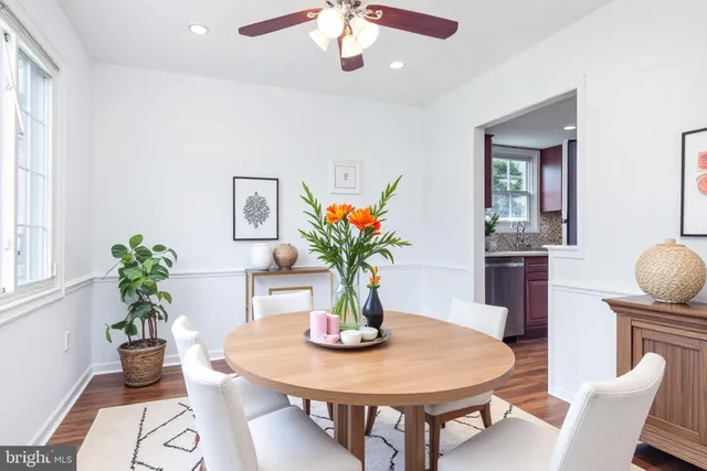 a kitchen with granite countertop a stove and a wooden floor