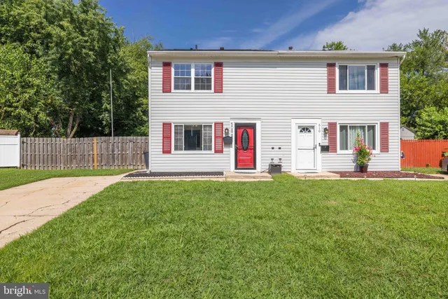 a swimming pool with outdoor seating and yard