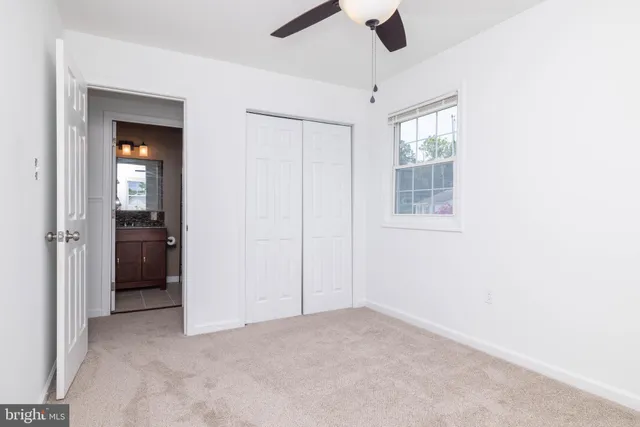 a view of a swimming pool with lawn chairs and a yard