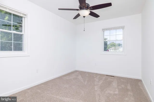 a balcony with wooden floor and lake view