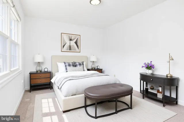 a kitchen with stainless steel appliances granite countertop a sink and a refrigerator