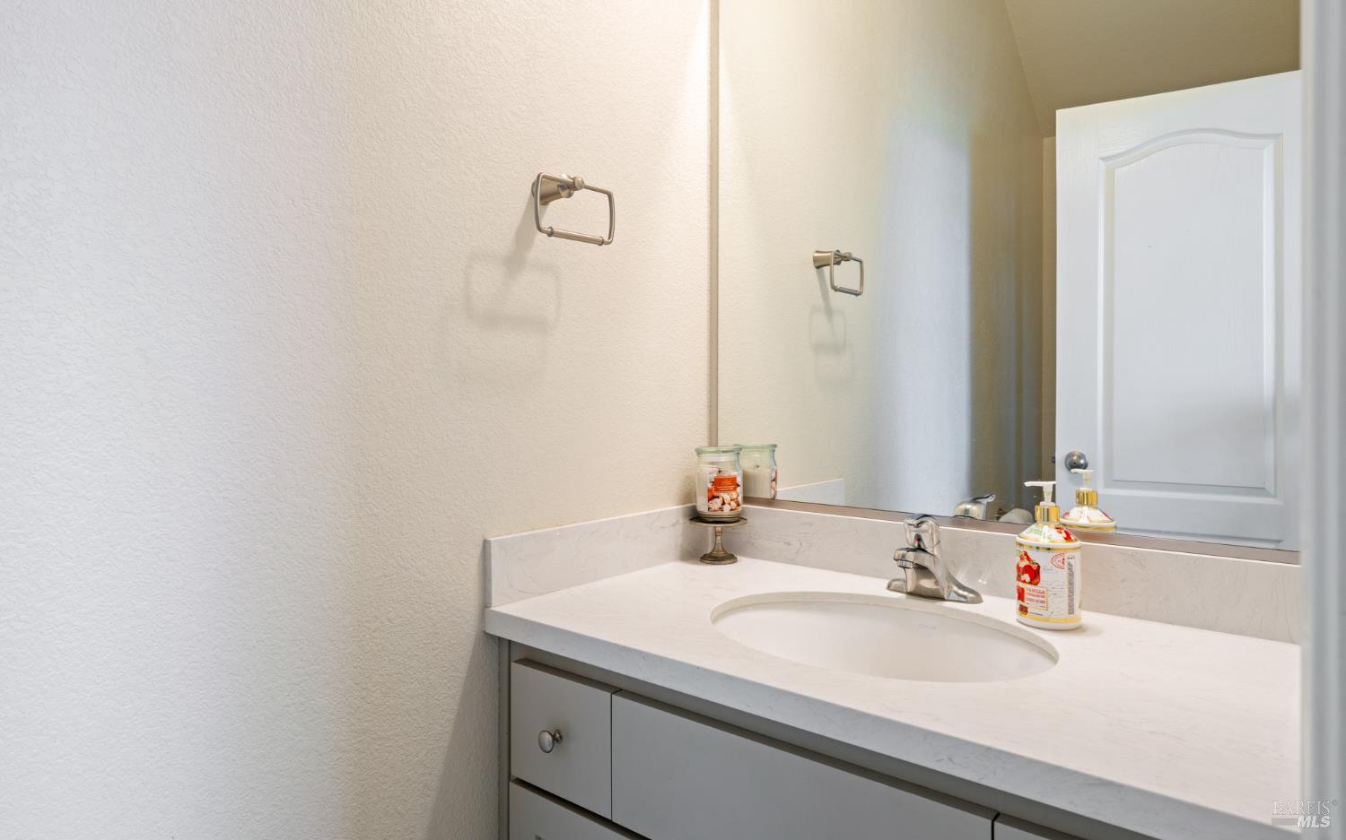 1461 Cecilia Drive Santa Rosa, CA 95401 - Photo 12 of 20 a bathroom with a sink and a mirror