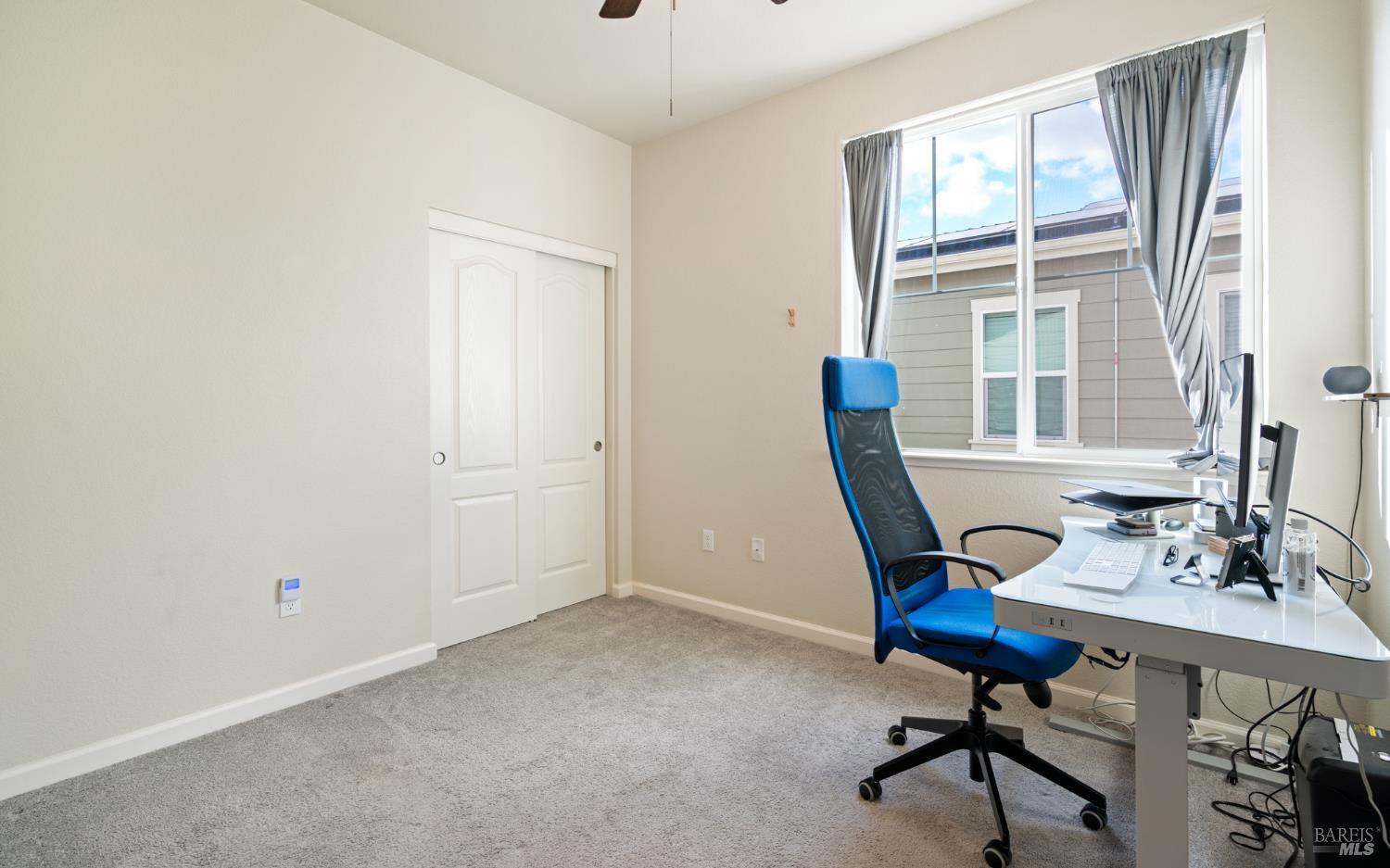 1461 Cecilia Drive Santa Rosa, CA 95401 - Photo 16 of 20 a view of a workspace with furniture and a window