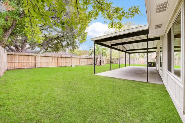 a view of a backyard with a garden and plants
