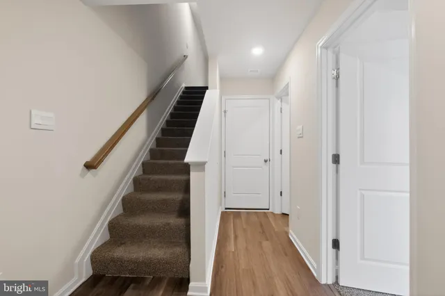 a view of entryway with wooden floor
