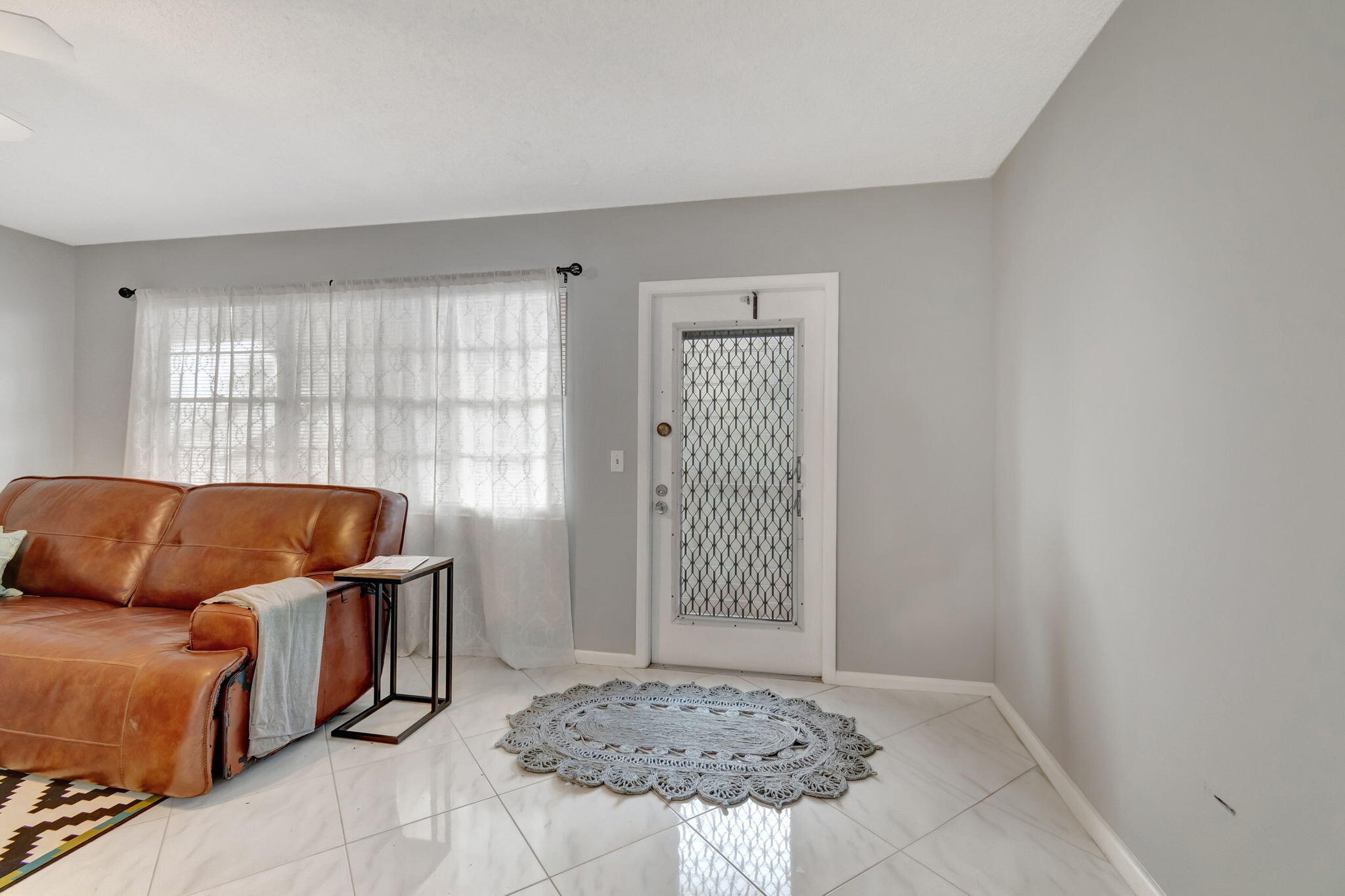 3031 Cornwall East Boca Raton, FL 33434 - Photo 2 of 84 a living room with a couch and a table