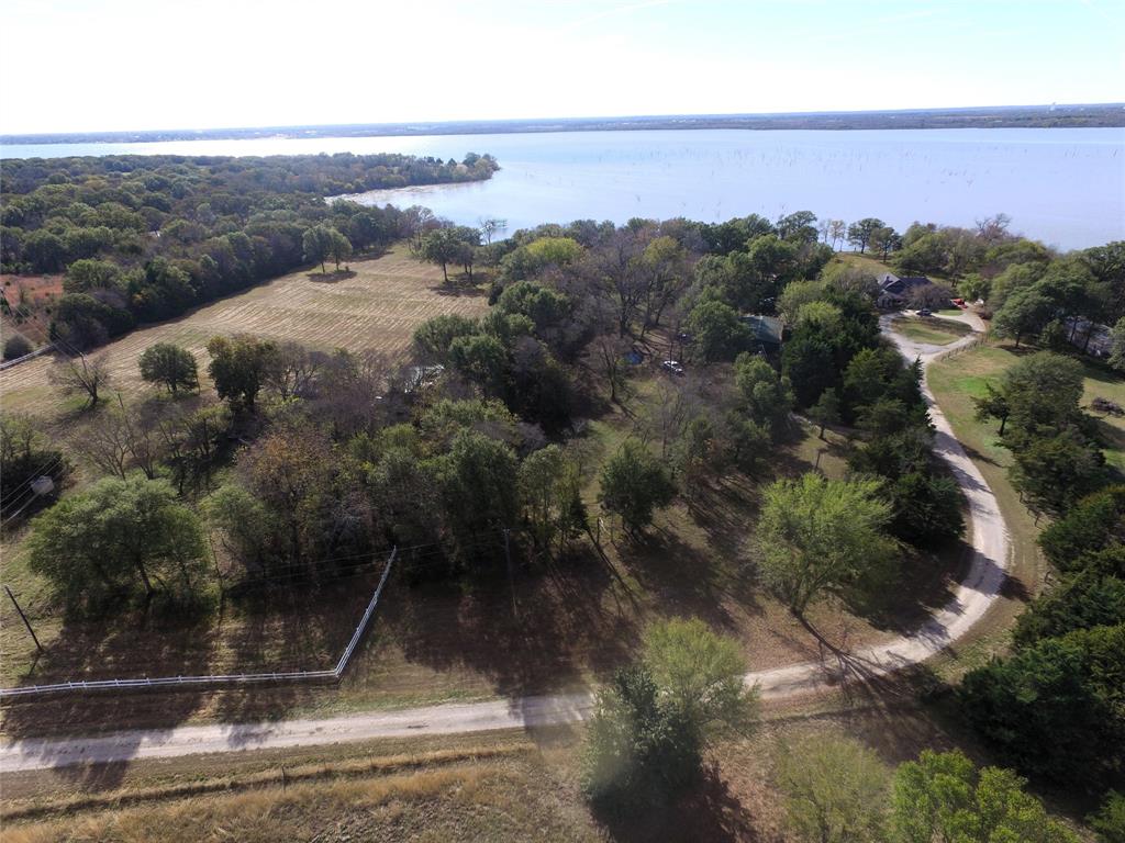 Tbd Callaway Lane Quinlan, TX 75474 - Photo 2 of 16 an aerial view of residential house and car parked