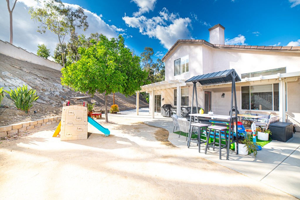 17801 Morning Rock Circle Riverside, CA 92503 - Photo 15 of 18 a view of a house with a swimming pool