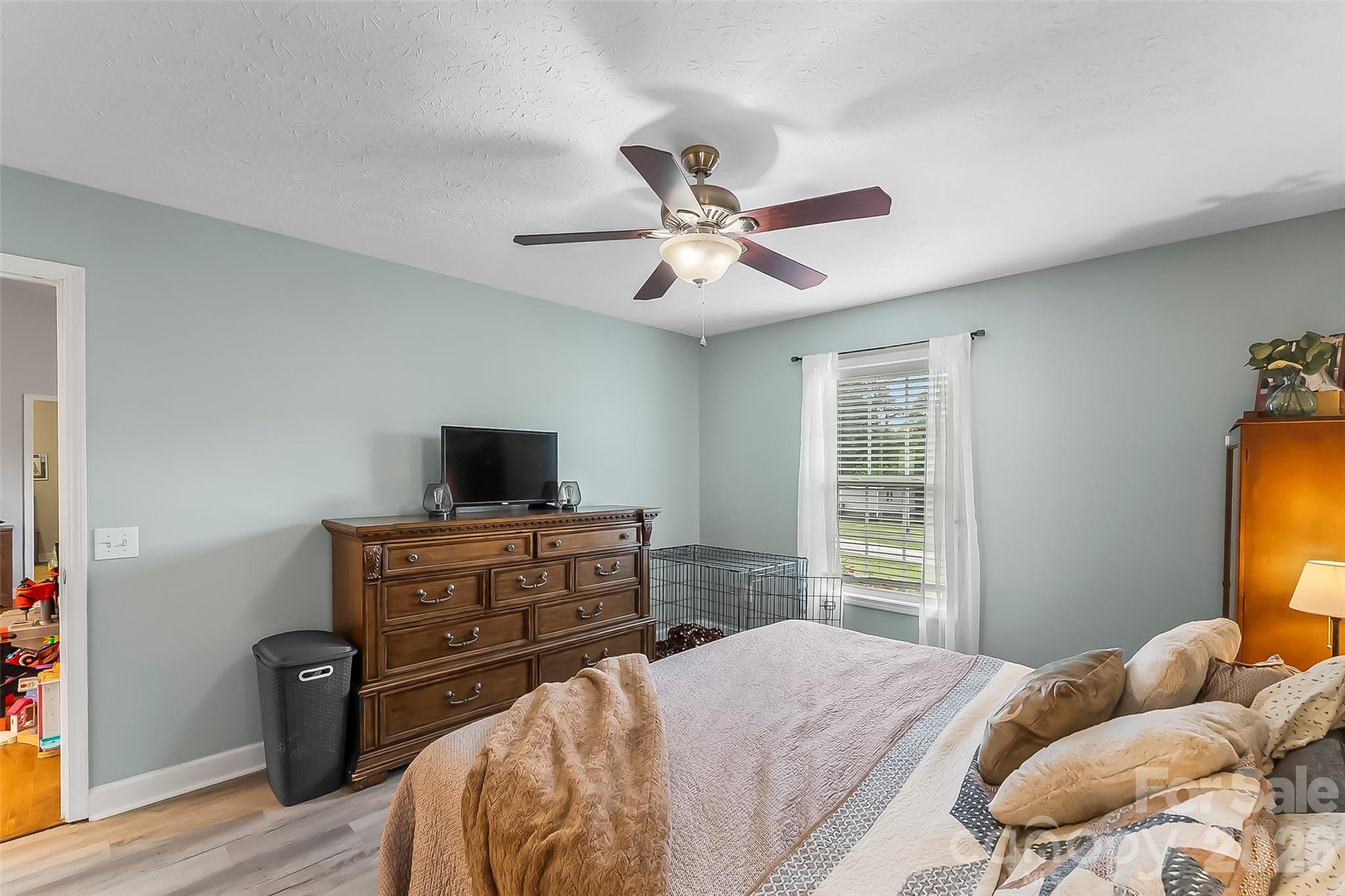 1498 Salem Road Morganton, NC 28655 - Photo 17 of 32 a bedroom with a bed and a television