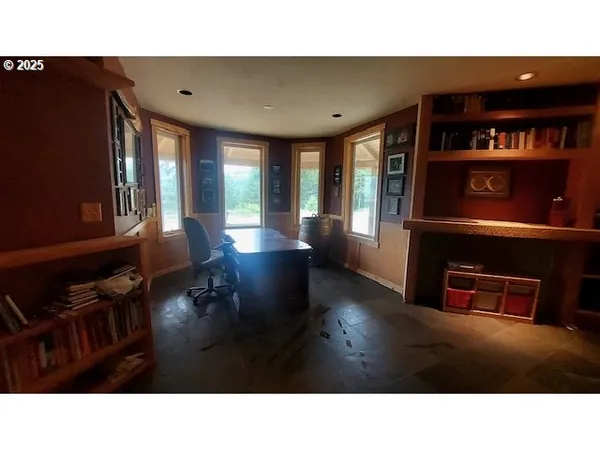 a open kitchen with stainless steel appliances granite countertop a living room
