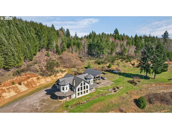 a aerial view of a house with a yard