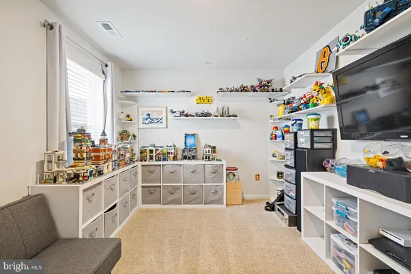 a kitchen with stainless steel appliances a stove a sink and a refrigerator