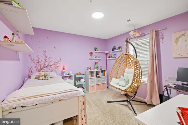 a view of a workspace with furniture and a bedroom