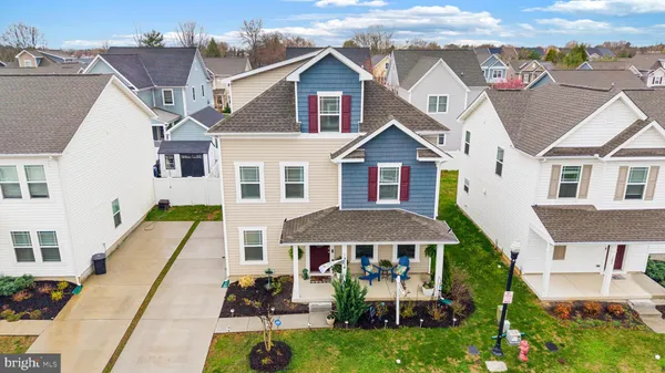 a aerial view of a house with a porch