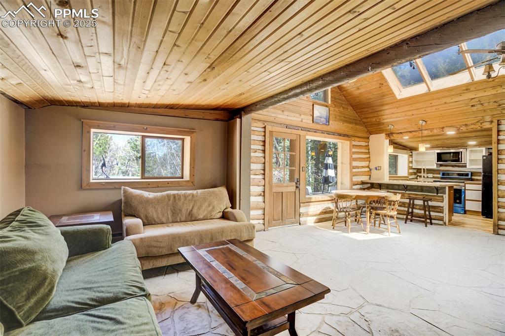 4560 Canonwood Road Colorado Springs, CO 80906 - Photo 11 of 50 a living room with furniture and a large window
