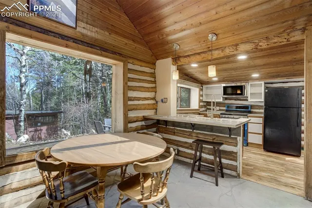 a dinning table and chairs in a patio