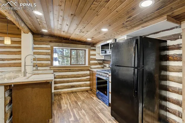 a kitchen with a refrigerator and countertop