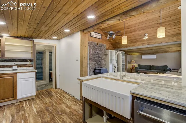 a kitchen with stainless steel appliances a stove and cabinets