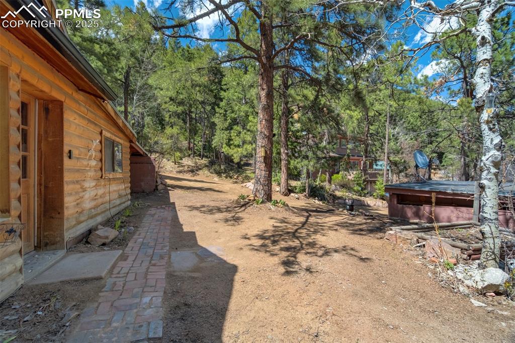 4560 Canonwood Road Colorado Springs, CO 80906 - Photo 32 of 50 a view of a backyard with sitting area