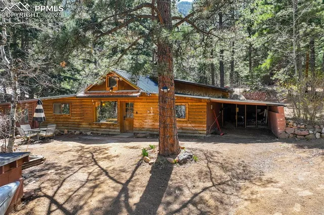 a front view of a house with a yard covered with snow
